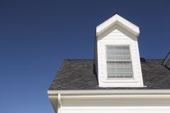 New Roof of House and Windows Against Deep Blue Sky royalty free stock images New Roof of House and Windows Against Deep Blue Sky royalty free stock images