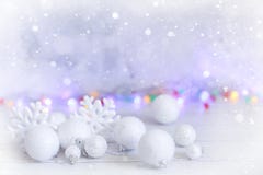 New year or Christmas decorations in silver and white colors with balls, snowflakes and garland bokeh stock images New year or Christmas decorations in silver and white colors with balls, snowflakes and garland bokeh stock images
