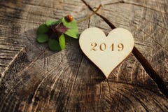 New year greetings with a wooden heart, lucky clover and a ladybird stock images New year greetings with a wooden heart, lucky clover and a ladybird stock images