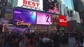 New York, USA Crowd by advertising billboards at Times Square. stock footage New York, USA Crowd by advertising billboards at Times Square. stock footage