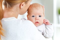 Newborn baby in embrace of mother Stock Image Newborn baby in embrace of mother Stock Image