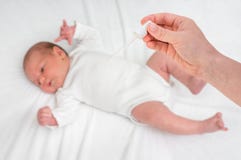 Newborn baby gets nose drops with saline solution stock images Newborn baby gets nose drops with saline solution stock images