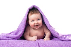 Newborn Baby Lying Down And Smiling In A Purple Towel Royalty Free Stock Image Newborn Baby Lying Down And Smiling In A Purple Towel Royalty Free Stock Image