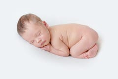 Newborn Baby Sleeping On A White Blanket Stock Photo