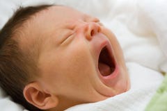 Newborn infant yawning