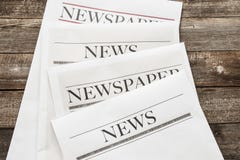 Newspaper on wooden background royalty free stock photography Newspaper on wooden background royalty free stock photography