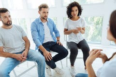 Nice depressed people having a group therapy session stock image Nice depressed people having a group therapy session stock image