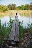 Nice girl sitting front the lake royalty free stock photos Nice girl sitting front the lake royalty free stock photos