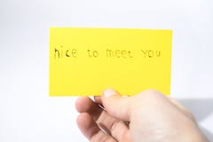 Nice to meet you handwrite with a hand on a yellow paper stock images Nice to meet you handwrite with a hand on a yellow paper stock images