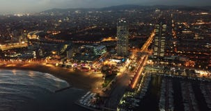 Night aerial view from drones of coast in Barcelona with sea and building