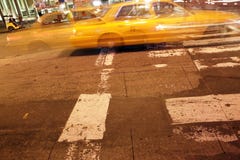 Night Capture Of A Taxi In New York City Stock Image