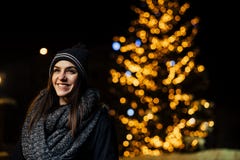 Night portrait of a beautiful brunette woman smiling enjoying winter in park.Winter joy.Winter holidays.Positive emotions. royalty free stock photo Night portrait of a beautiful brunette woman smiling enjoying winter in park.Winter joy.Winter holidays.Positive emotions. royalty free stock photo