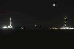 Night Shot of Two Oil Rigs in North Dakota
