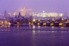 Night Snowy Foggy Prague Lesser Town With Charles Bridge And Gothic Castle In The Snowstorm, Czech Republic Royalty Free Stock Photo Night Snowy Foggy Prague Lesser Town With Charles Bridge And Gothic Castle In The Snowstorm, Czech Republic Royalty Free Stock Photo
