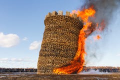 Nikola-Lenivets - March 9, 2019: Pancake week. Burning of the fortress of the Bastille stock image Nikola-Lenivets - March 9, 2019: Pancake week. Burning of the fortress of the Bastille stock image