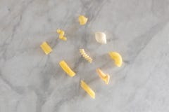 Nine types of different pasta rest on a marble table with copy space for your text royalty free stock photos Nine types of different pasta rest on a marble table with copy space for your text royalty free stock photos