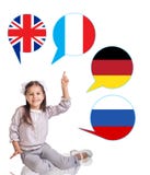 Niña y burbujas con las banderas de países Imagen de archivo