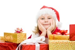 Niño de la feliz Navidad con los regalos en los rectángulos Foto de archivo Niño de la feliz Navidad con los regalos en los rectángulos Foto de archivo