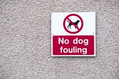 No dog fouling large clear sign on wall royalty free stock photo No dog fouling large clear sign on wall royalty free stock photo