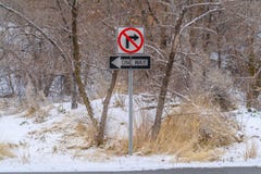 No Right Turn and One Way sign against snowy trees royalty free stock image No Right Turn and One Way sign against snowy trees royalty free stock image