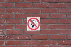 The no Smoking sign on the brick wall royalty free stock photo The no Smoking sign on the brick wall royalty free stock photo