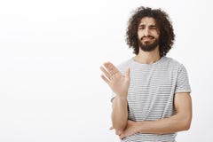 No thanks, I pass. Displeased uninterested handsome curly-haired male in stylish striped t-shirt, waving palm in no or stock photos No thanks, I pass. Displeased uninterested handsome curly-haired male in stylish striped t-shirt, waving palm in no or stock photos