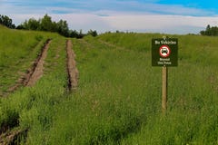 No vehicles beyond this point sign with a road in the background Stock Photos No vehicles beyond this point sign with a road in the background Stock Photos