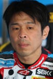 Noriyuki Haga #41 su BMW S1000 RR con il gruppo WSBK di Grillini DENTALMATIC SBK immagine stock libera da diritti Noriyuki Haga #41 su BMW S1000 RR con il gruppo WSBK di Grillini DENTALMATIC SBK immagine stock libera da diritti