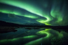 Northern Lights Above A Lagoon In Iceland Stock Photo Northern Lights Above A Lagoon In Iceland Stock Photo