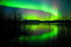 Northern lights mirrored on lake