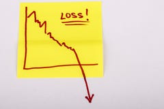 Note paper with finance business graph going down - loss royalty free stock photo Note paper with finance business graph going down - loss royalty free stock photo