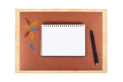 Notebook on brown textured paper imitating a frame stock images Notebook on brown textured paper imitating a frame stock images