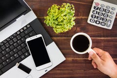 Notebook computer on the desk.Calculators,USB flash drive stick,coffee cup,smartphone royalty free stock images Notebook computer on the desk.Calculators,USB flash drive stick,coffee cup,smartphone royalty free stock images