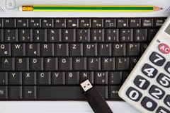 Notebook computer on the desk.Calculators,USB flash drive stick,Pencil royalty free stock images Notebook computer on the desk.Calculators,USB flash drive stick,Pencil royalty free stock images