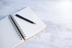 Notebook with a pen on the desktop stock image Notebook with a pen on the desktop stock image