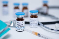 Novel coronavirus covid-19 vaccine vial with syringe and stethoscope