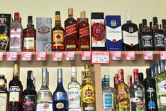 Novi Sad, Serbia, 06.02.2018 alcoholic beverages on the shelf. With prices, yellow wall background royalty free stock images Novi Sad, Serbia, 06.02.2018 alcoholic beverages on the shelf. With prices, yellow wall background royalty free stock images