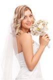 Novia joven que lleva a cabo una boda de flores fotos de archivo libres de regalías Novia joven que lleva a cabo una boda de flores fotos de archivo libres de regalías