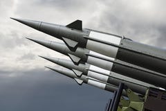 Nuclear Missles With Warhead Aimed at Gloomy Sky. Balistic Rockets War Backgound.