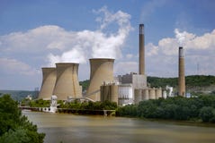 Nuclear Plant on the River. A nuclear power plant situated along side a river Nuclear Plant on the River. A nuclear power plant situated along side a river
