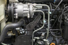 Nuevo motor de tractor diesel agrícola moderno Nuevo motor de alta tecnología moderno del cargador o del pequeño tractor Visión s fotografía de archivo Nuevo motor de tractor diesel agrícola moderno Nuevo motor de alta tecnología moderno del cargador o del pequeño tractor Visión s fotografía de archivo