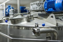A number of electric motors with reducers. Tanks for mixing liquids. royalty free stock images A number of electric motors with reducers. Tanks for mixing liquids. royalty free stock images