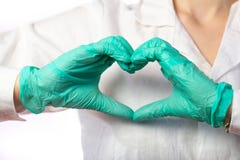Nurse in gloves showing heart gesture, close up royalty free stock photos Nurse in gloves showing heart gesture, close up royalty free stock photos