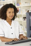 Nurse working on computer in pharmacy royalty free stock photos Nurse working on computer in pharmacy royalty free stock photos