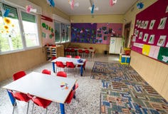 Nursery class with tables and small red chairs royalty free stock image Nursery class with tables and small red chairs royalty free stock image