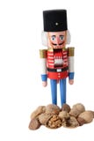 Nutcracker Soldier With A Pile Of Walnuts Royalty Free Stock Images