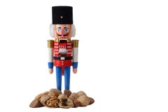 Nutcracker Soldier With Pile Of Nuts Royalty Free Stock Image