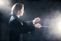 O condutor da música inspirou maestros foto de stock O condutor da música inspirou maestros foto de stock