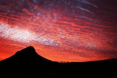 O fogo do por do sol sobre leões dirige em Cape Town imagem de stock O fogo do por do sol sobre leões dirige em Cape Town imagem de stock