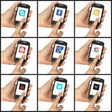 O jogo da rede social abotoa-se em um smartphone imagem de stock royalty free O jogo da rede social abotoa-se em um smartphone imagem de stock royalty free